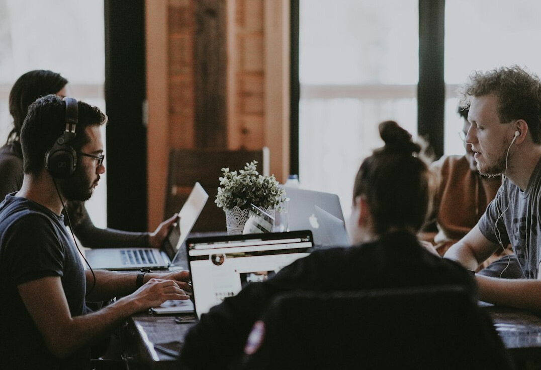 team using technology in meeting